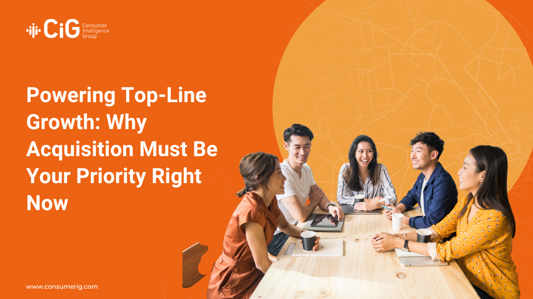A group of marketers sitting at a table having a meeting